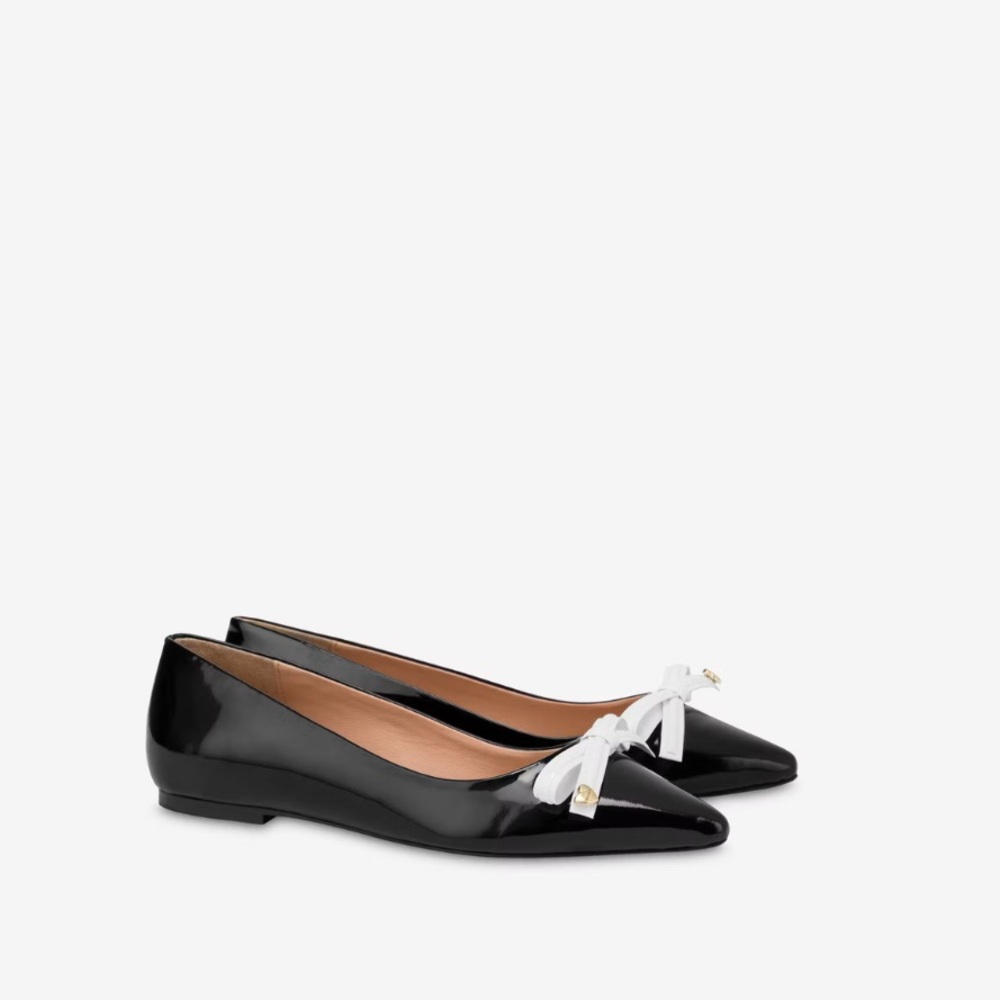 Black patent pointed flats with white bow size 9